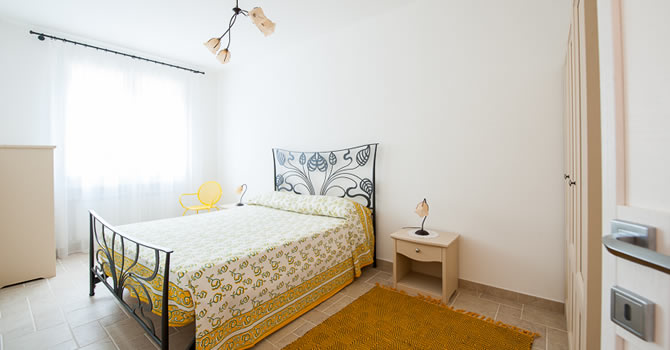 Immagine della camera da letto dell’appartamento Ginestra